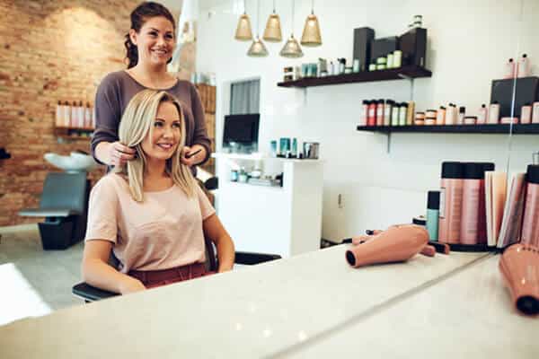 Hair Stylist showing client end hair result