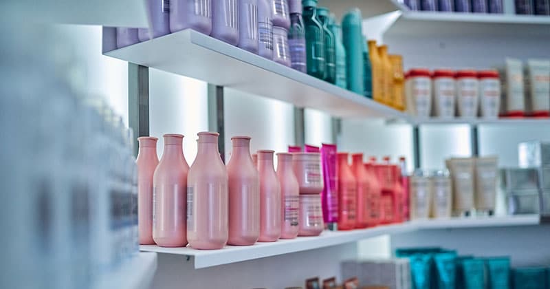 Beauty products on wall shelves