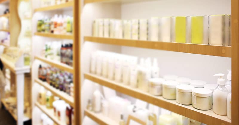 Wall of shelves with salon retail products