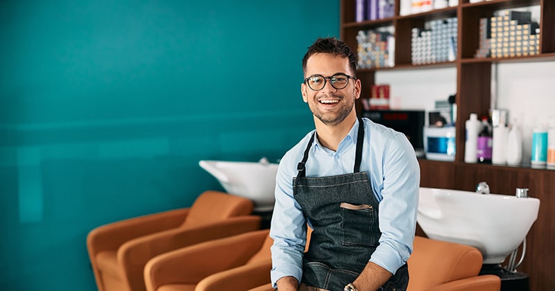 a guy sitting in front of a shampoo bar