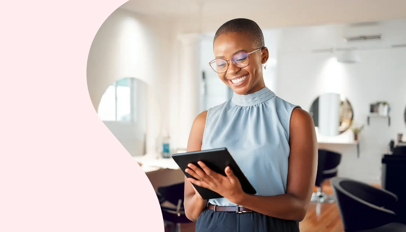 Woman using a tablet in a salon