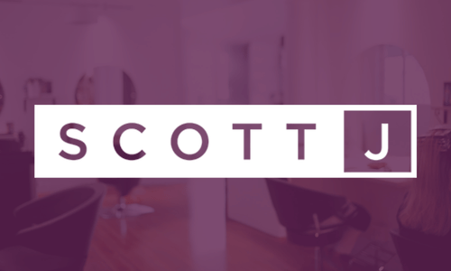 A purple-tinted image of a modern salon with "SCOTT J" in bold, white letters centered over the background, capturing the sleek ambiance and innovative vibe inspired by salonbiz insights.