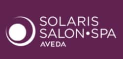 Logo for Solaris Salon Spa Aveda on a purple background. The design features a white circular graphic on the left, with the salon’s name in bold uppercase letters to the right, reminiscent of software demo branding for modern businesses.
