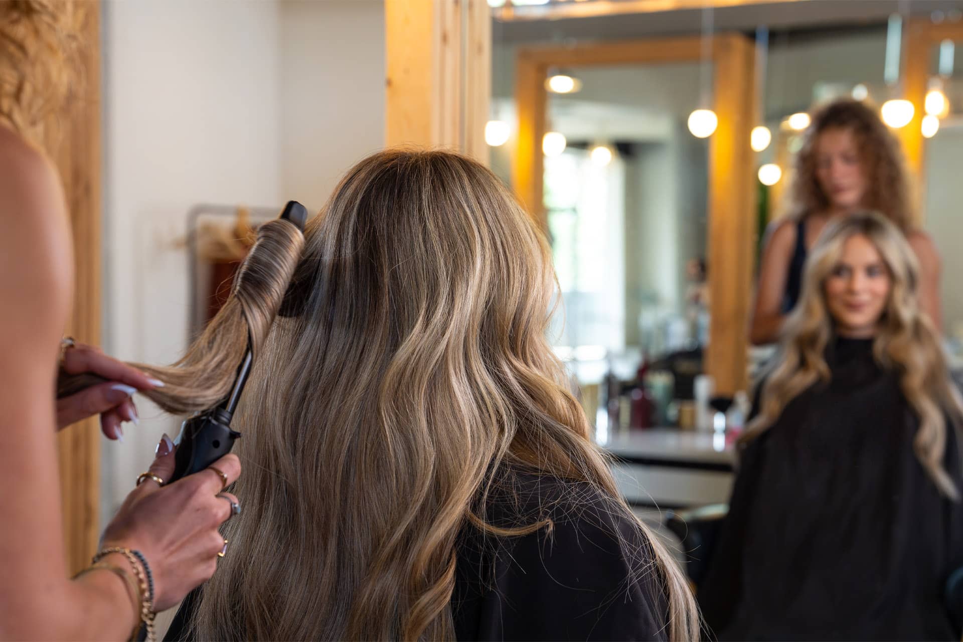 woman in a salon getting her hair styled