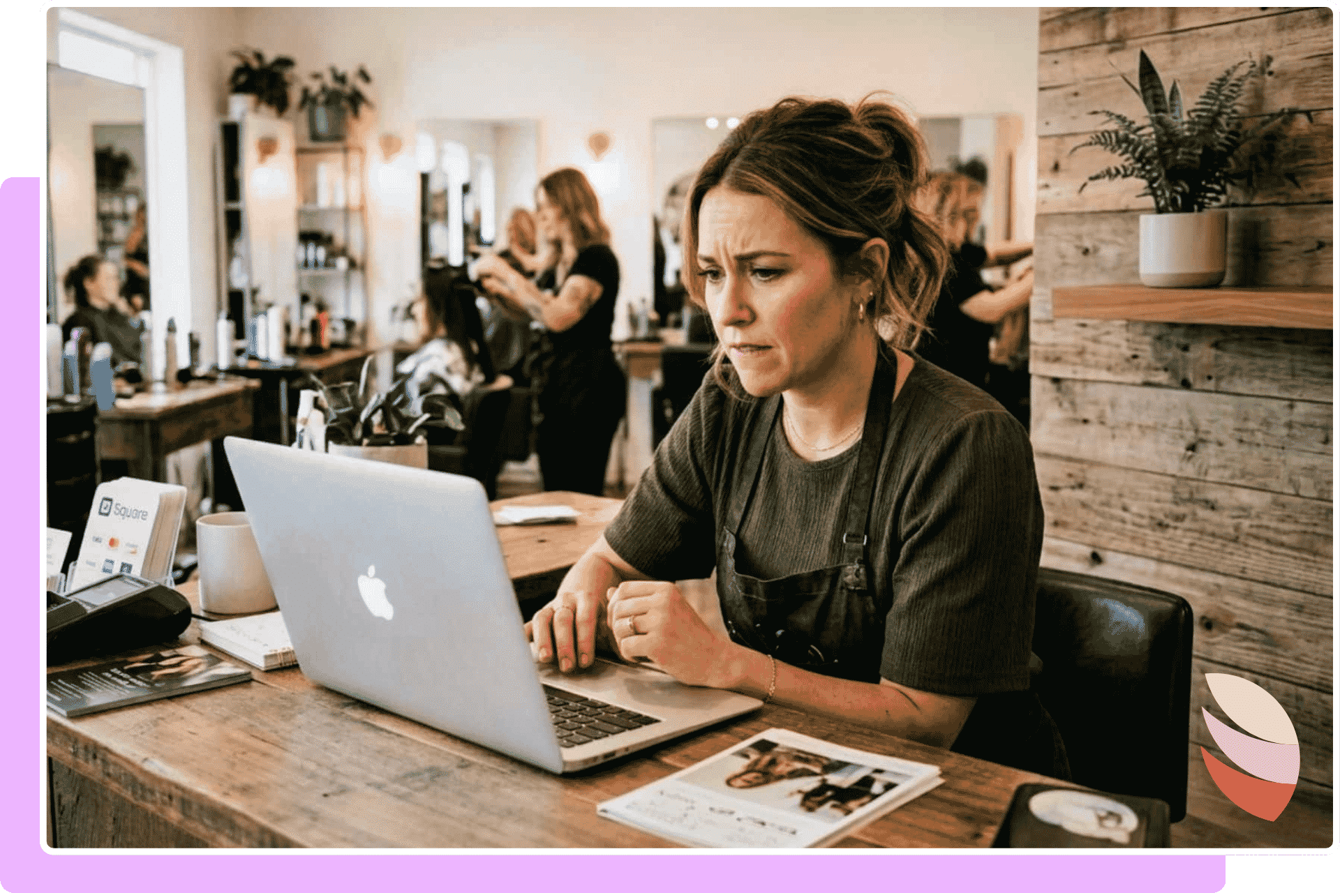 Salon Owner looking at a laptop