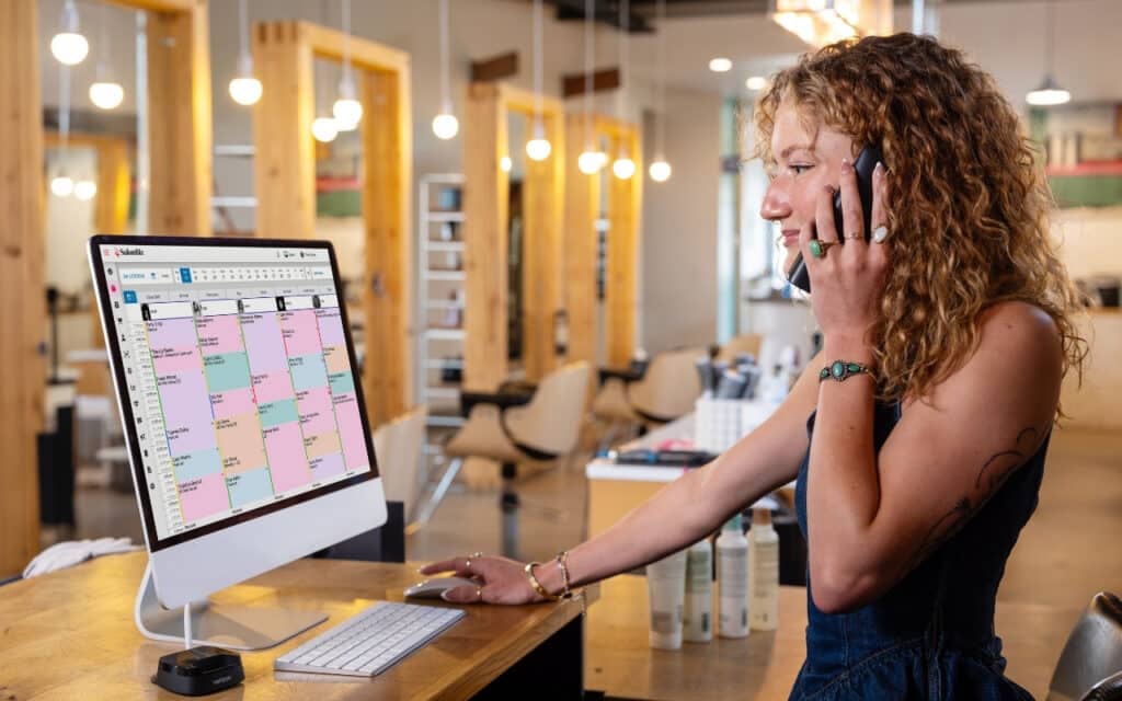 a salon working using the online scheduling tools