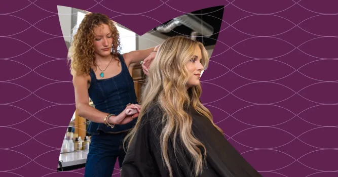 A hair stylist working with a client in the salon chair