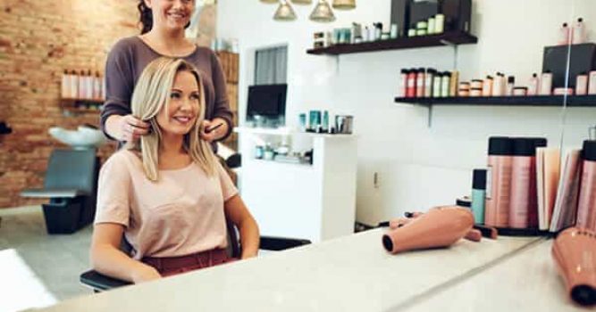 Hair Stylist showing client end hair result