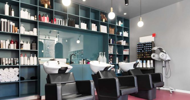 Salon chairs in front of shelves of beauty products