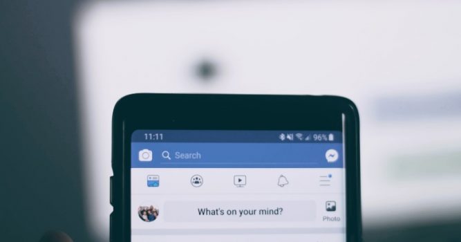 Facebook pulled up on a mobile phone